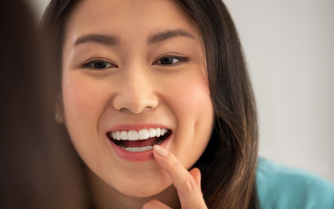 Woman looking in mirror