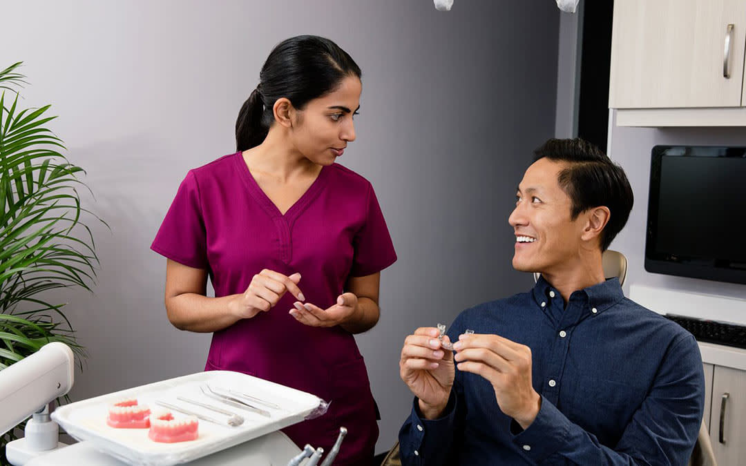 Doctor and patient with Invisalign aligner