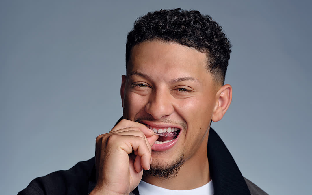 Patrick Mahomes putting in Invisalign aligners